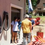 Greg Cowen helps guests get ready for river rafting