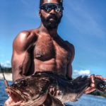 MMA fighter Lance Gibson Jr. lands a large fish at Texada Island